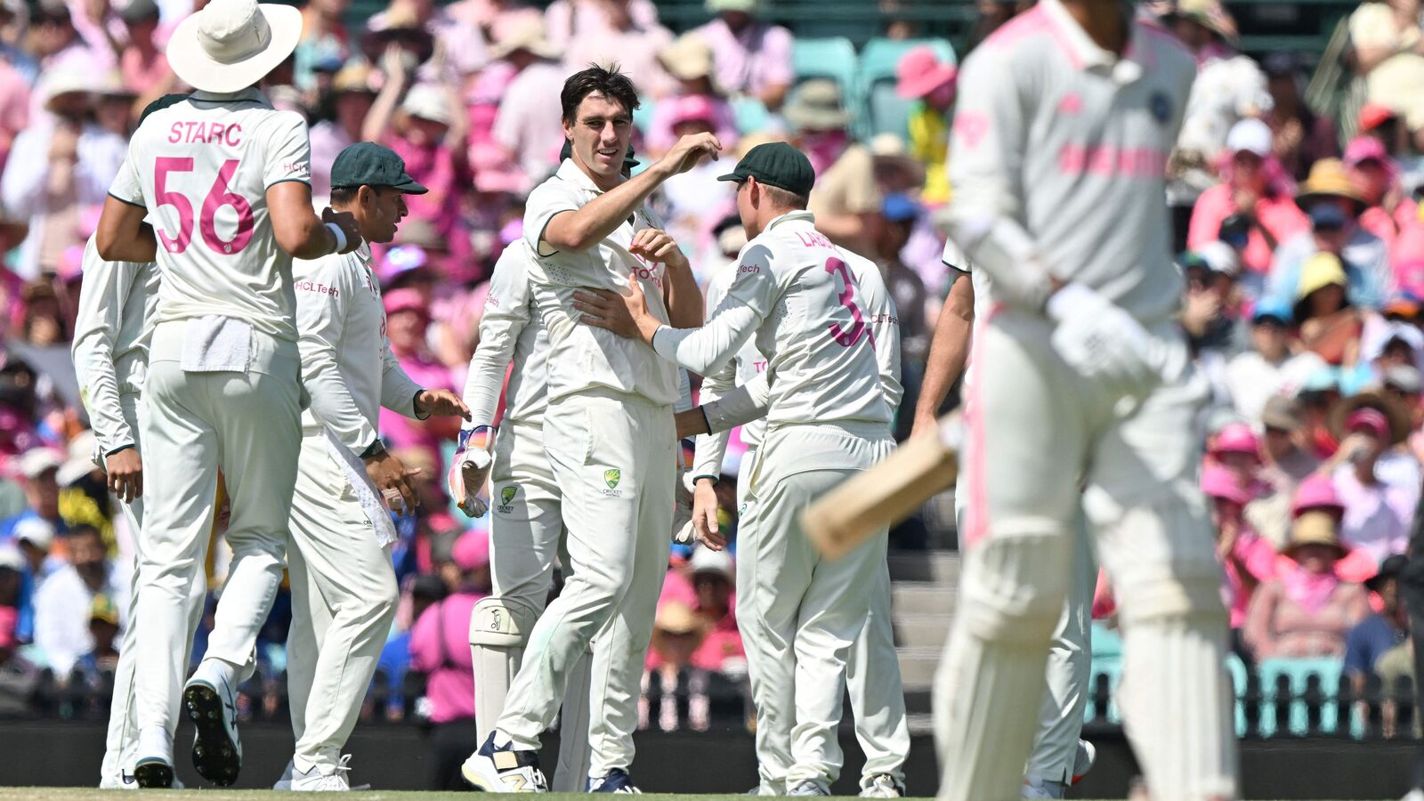 Australia�s Pat Cummins (C) celebrates the wicket of India�s Ravindra Jadeja with teammates on day three of the fifth Test match between Australia and India at the Sydney Cricket Ground on January 5, 2025. (Photo by Saeed KHAN / AFP) / -- IMAGE RESTRICTED TO EDITORIAL USE - STRICTLY NO COMMERCIAL USE --