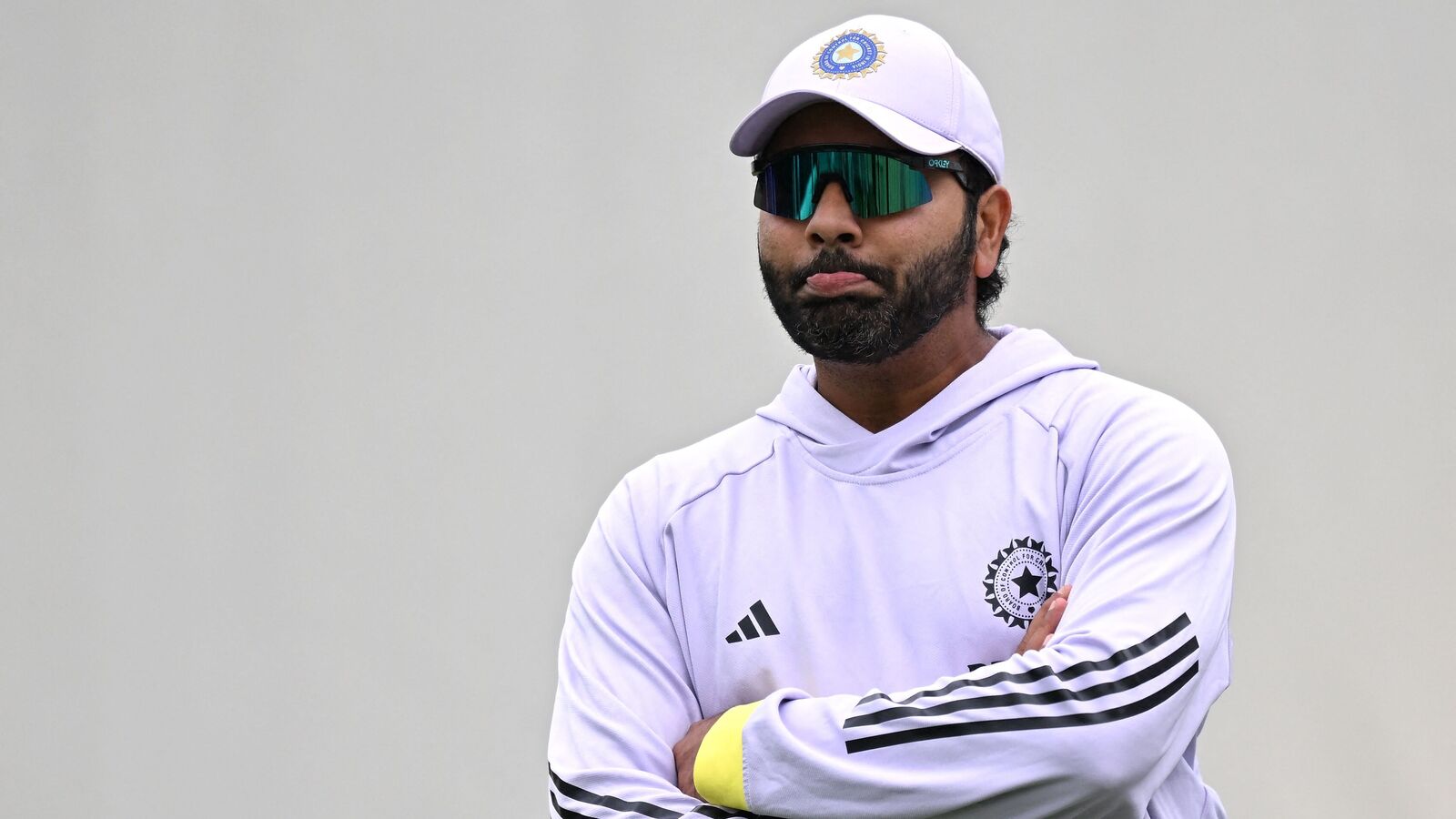 India's Rohit Sharma watches teammates during a practice session ahead of the fifth cricket Test match between Australia and India at the Sydney Cricket Ground in Sydney on January 2, 2025. (Photo by Saeed KHAN / AFP) 