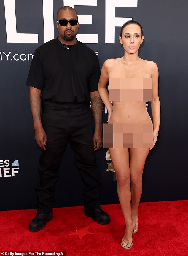 On the instructions of her husband, 30-year-old Bianca Censori dropped her black fur coat to the floor, revealing herself to be naked save for a layer of near invisible fabric, while on the red carpet at the Grammy awards last week