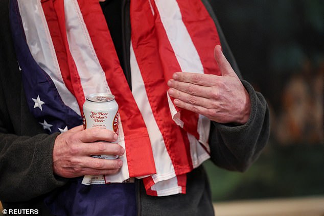 Fogel was pictured carrying a beer from Iron City Brewing Company