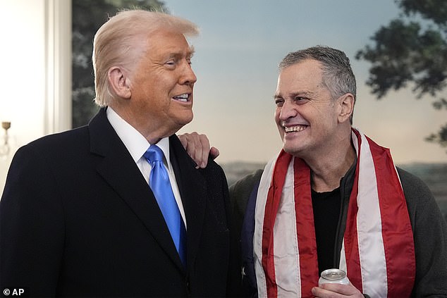 Trump and Fogel smile as they address the media