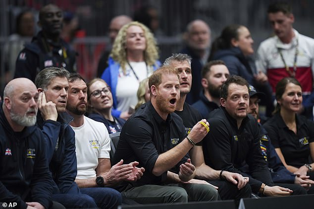 Prince Harry watches the UK and France play during the wheelchair rugby final yesterday