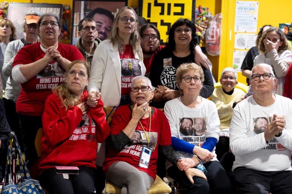 Friends of freed hostage Iair Horn react as they are gathering to watch live viewing of his release (Getty Images)