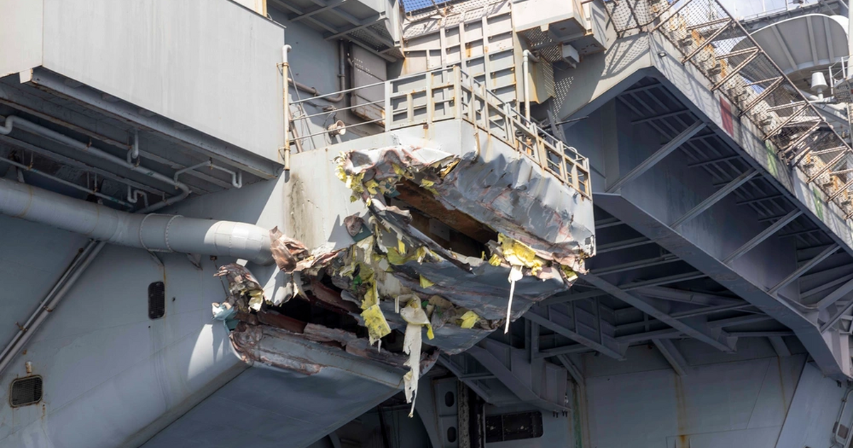 USS Harry Truman collision damage revealed in new photos as the aircraft carrier returns to port for repairs