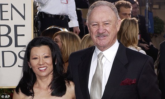 FILE - Actor Gene Hackman arrives with his wife, Betsy Arakawa, for the 60th Annual Golden Globe Awards in Beverly Hills, Calif., Sunday, Jan. 19, 2003. (AP Photo/Mark J. Terrill, File)