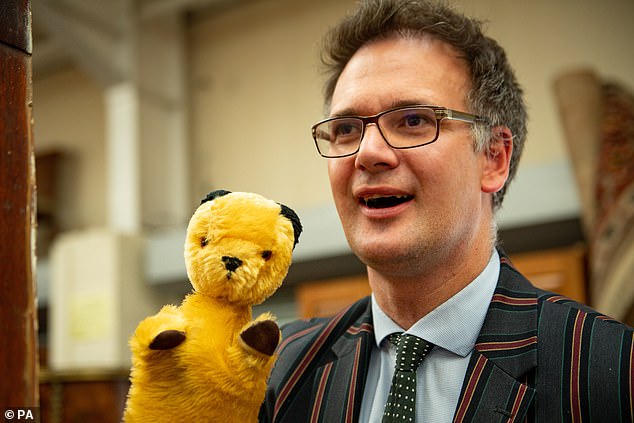 Bargain Hunt star, auctioneer Charles Hanson, with an original Sooty TV puppet, which was auctioned at Hansons Auctioneers in Derbyshire