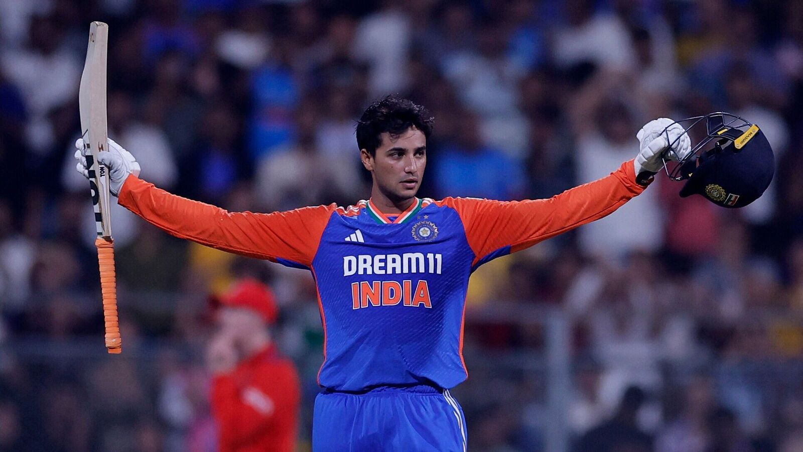 India's Abhishek Sharma celebrates after reaching his century.