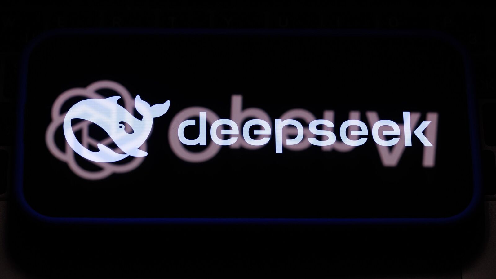 The logos of the DeepSeek, ChatGPT and OpenAI artificial intelligence apps on a mobile phone, arranged in Riga, Latvia, on Wednesday, Jan. 29, 2025. Microsoft Corp.�and OpenAI are investigating whether data output from OpenAI�s technology was obtained in an unauthorized manner by a group linked to Chinese artificial intelligence startup DeepSeek, according to people familiar with the matter. Photographer: Andrey Rudakov/Bloomberg