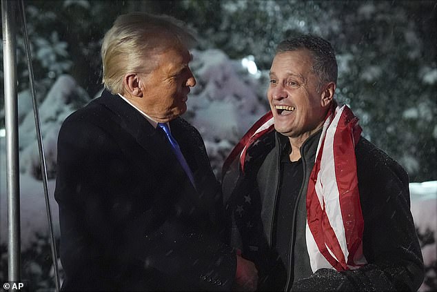 President Donald Trump greets Marc Fogel at on the South Lawn at the White House, Tuesday, Feb. 11, 2025, in Washington