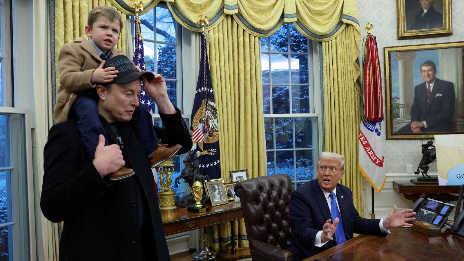 FILE PHOTO: U.S. President Donald Trump speaks as Elon Musk carries X ? A-12 on his shoulders in the Oval Office of the White House in Washington, D.C., U.S., February 11, 2025.   REUTERS/Kevin Lamarque/File Photo