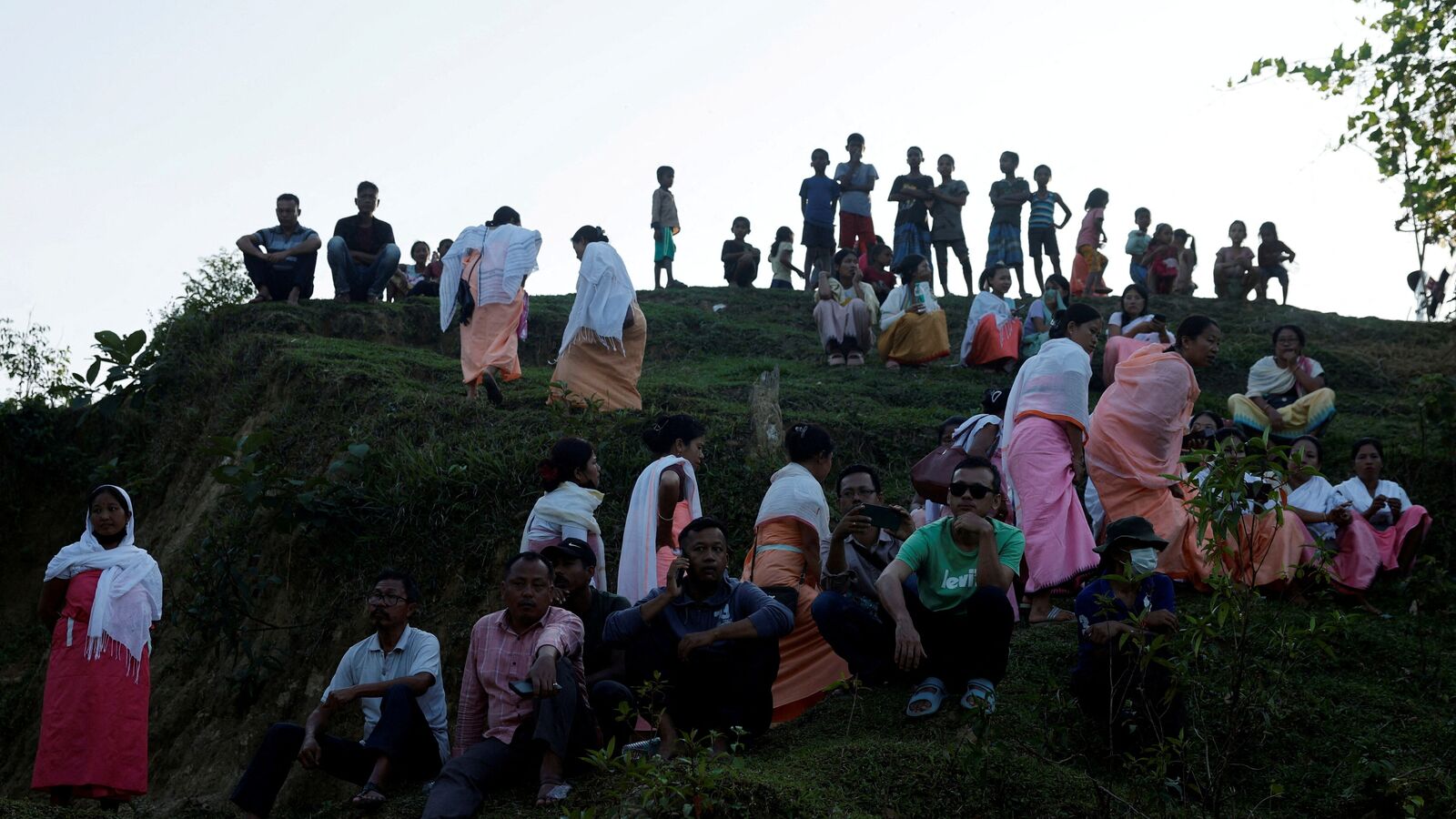 People watch a funeral of Meiteis who were killed after ethnic violence broke out in Borobekra, Jiribam in the northeastern state of Manipur, India, November 22, 2024. 