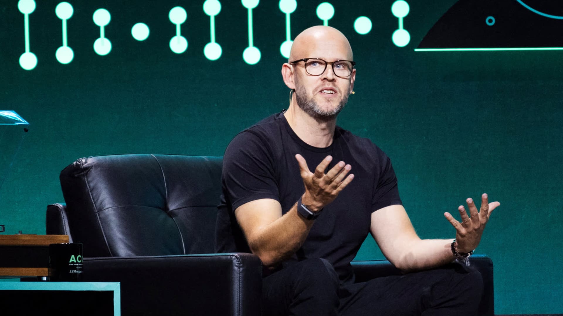 Spotify shares pop 10% after company reports first profitable year