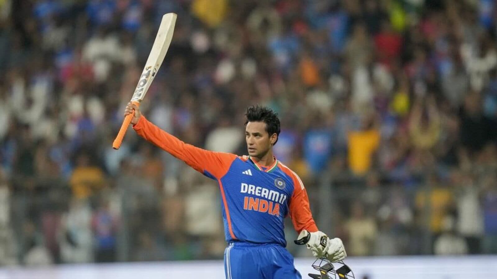 India's Abhishek Sharma acknowledges the crowd as he leaves the ground after losing his wicket during the fifth Twenty20 cricket match between India and England at Wankhede Stadium in Mumbai, India, Sunday, Feb. 2, 2025.(AP Photo/Rafiq Maqbool) (AP)