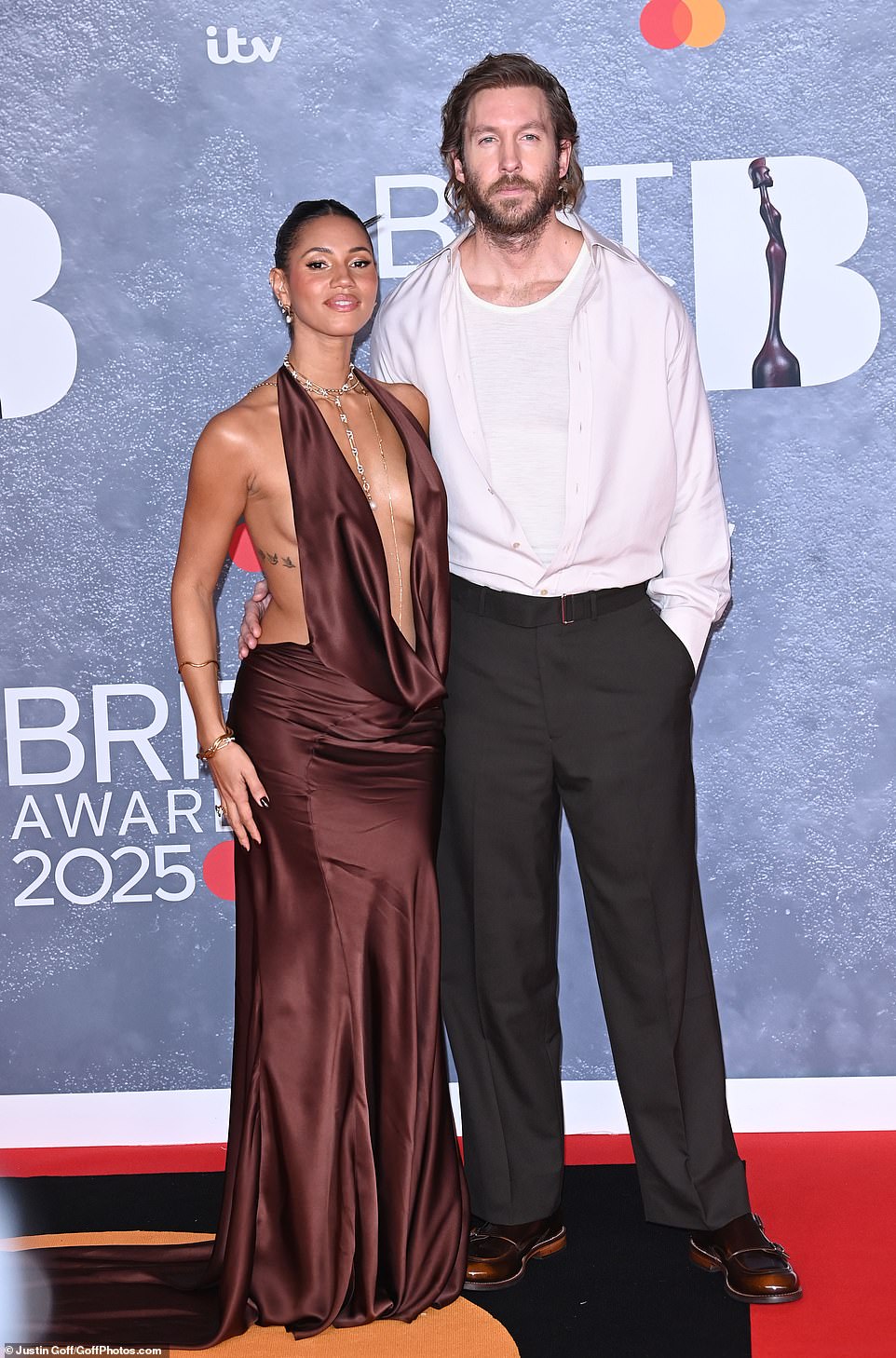 Vick put on a busty display in the number, which had a very daring neckline, as she stepped out alongside her husband Calvin Harris