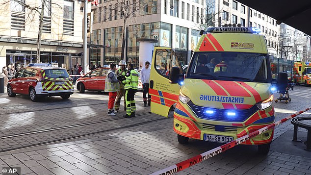 Emergency services and police stand at Paradeplatz in Mannheim, Germany, after a serious incident, Monday March 3