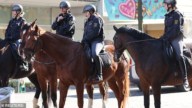 Mounted police patrol near the scene after a car drove into a crowd, in Mannheim, Germany