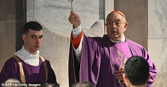 Italian cardinal Angelo De Donatis leads a holy mass at the Church of Saint Sabina in Rome during the celebration of Ash Wednesday as Pope Francis is still hospitalized with pneumonia, on March 5, 2025. Pope Francis's condition was stable on March 5, 2025 as he neared three weeks in hospital battling pneumonia, a Vatican source said, with celebrations for the Lent religious season starting without him. (Photo by Alberto PIZZOLI / AFP) (Photo by ALBERTO PIZZOLI/AFP via Getty Images)