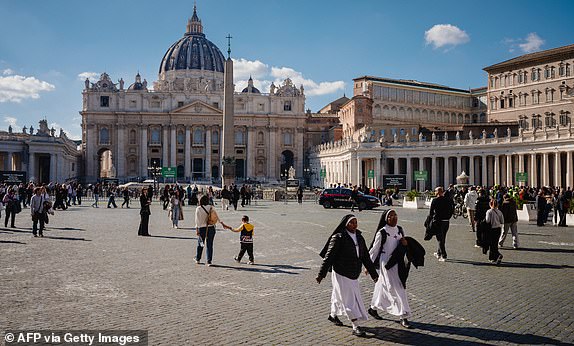 Nuns walk in St Peter's square in The Vatican on March 04, 2025. Pope Francis was breathing without a mask on March 4, 2025 after suffering two bouts of acute respiratory failure, the Vatican said as the leader of the world's Catholics spent his 19th day in hospital with pneumonia. (Photo by Dimitar DILKOFF / AFP) (Photo by DIMITAR DILKOFF/AFP via Getty Images)