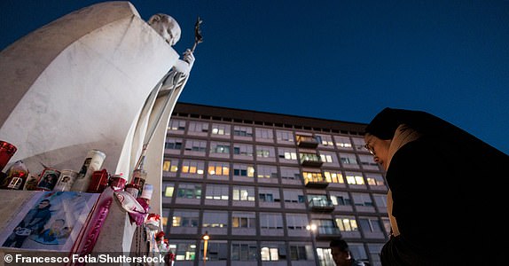 Mandatory Credit: Photo by Francesco Fotia/Shutterstock (15177936a) Faithful pray in front of a statue of Pope John Paul II at the entrance to the Gemelli Hospital, where Pope Francis remains hospitalized, in Rome, Italy, 03 March 2025. 3 Mar 2025 Pope Francis remains hospitalized in Rome, Italy - 03 Mar 2025, Roma, Italia - 03 Mar 2025