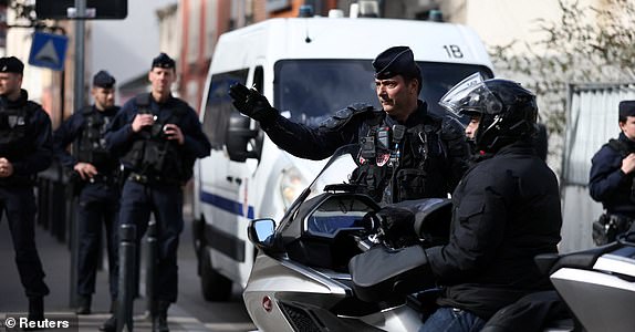 French police secure the area close to the site where an unexploded bomb dating back to World War Two was discovered 2.5 km (1.55 miles) from the Paris Gare du Nord train station, which has disrupted train traffic, in Saint-Denis near Paris, France, March 7, 2025. REUTERS/Benoit Tessier