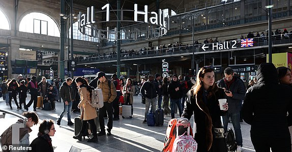 Passengers wait inside the departure hall as traffic has been disrupted at the Gare du Nord train station following the discovery of an unexploded bomb dating back to World War Two 2.5 km (1.55 miles) from the train station, in the middle of the train tracks, France, March 7, 2025. REUTERS/Benoit Tessier