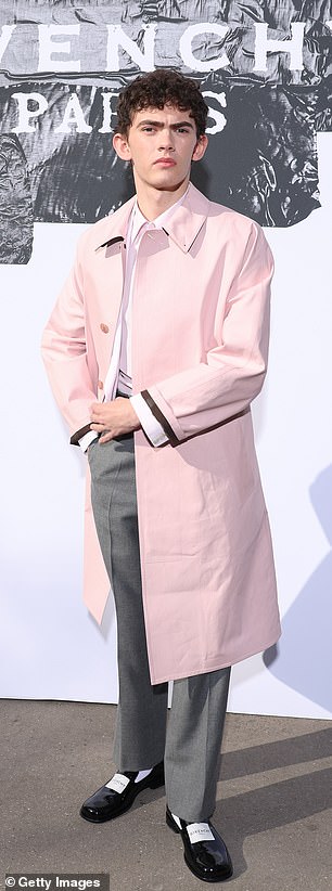 Joe, 21, who plays Charlie Spring, got into the spirit of Spring in a pastel pink trench coat layered over grey trousers and a white shirt