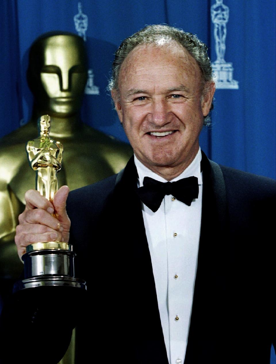 Actor Gene Hackman holds his Oscar on March 29, 1993, after winning the award for best supporting actor for his role in "Unforgiven" at the 65th Academy Awards in Los Angeles.