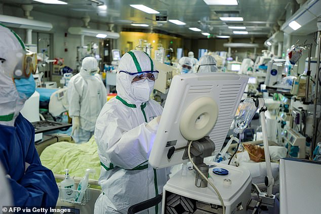 Medical staff treating patients infected by the COVID-19 coronavirus at a hospital in Wuhan in China's central Hubei province