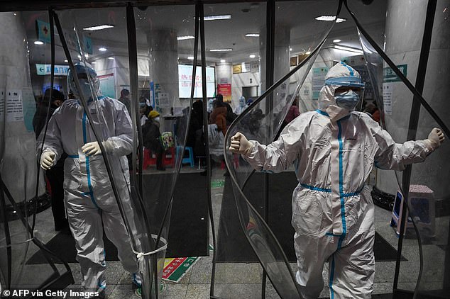 This file photo taken January 25, 2020 shows medical staff members, wearing protective clothing at the Wuhan Red Cross Hospital in Wuhan, as the city struggled with the outbreak of the once-mysterious virus