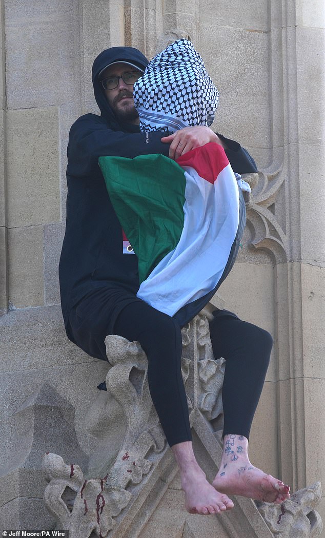 A man who scaled the Elizabeth Tower has now been sitting on the ledge of the historic landmark smeared with blood for four hours