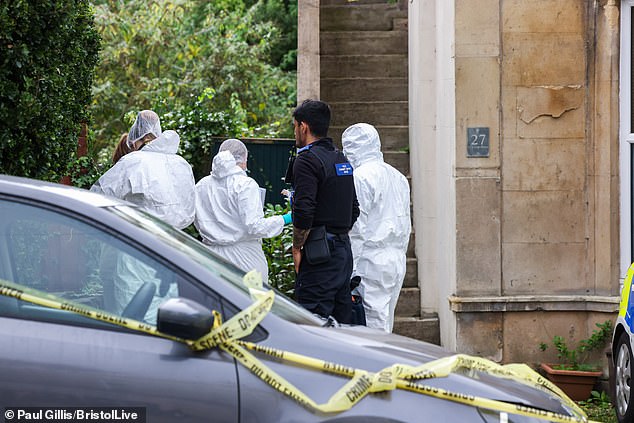 Forensic investigators pictured at the scene where the girls body was found at 6:30pm on October 20