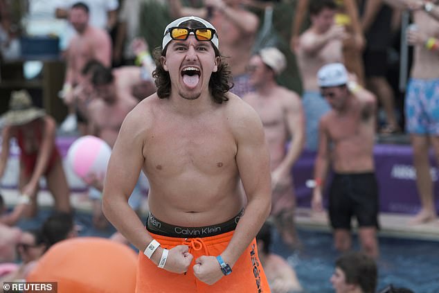 A man poses for a photo as he enjoys Spring Break in Cancun