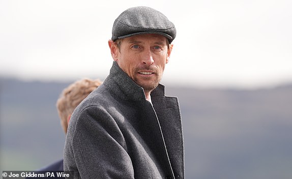 Former footballer Peter Crouch arrives on day three of the 2025 Cheltenham Festival at Cheltenham Racecourse. Picture date: Thursday March 13, 2025. PA Photo. See PA story RACING Cheltenham. Photo credit should read: Joe Giddens/PA Wire.RESTRICTIONS: Use subject to restrictions. Editorial use only, no commercial use without prior consent from rights holder.