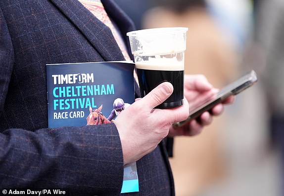 A view of a pint of Guinness  and race card on day three of the 2025 Cheltenham Festival at Cheltenham Racecourse. Picture date: Thursday March 13, 2025. PA Photo. See PA story RACING Cheltenham. Photo credit should read: Adam Davy/PA Wire.RESTRICTIONS: Use subject to restrictions. Editorial use only, no commercial use without prior consent from rights holder.