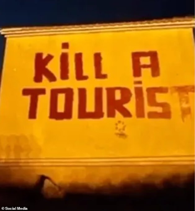 Graffiti reading 'kill a tourist' has been spotted on a wall in Tenerife amid Spain's anti-protest movement