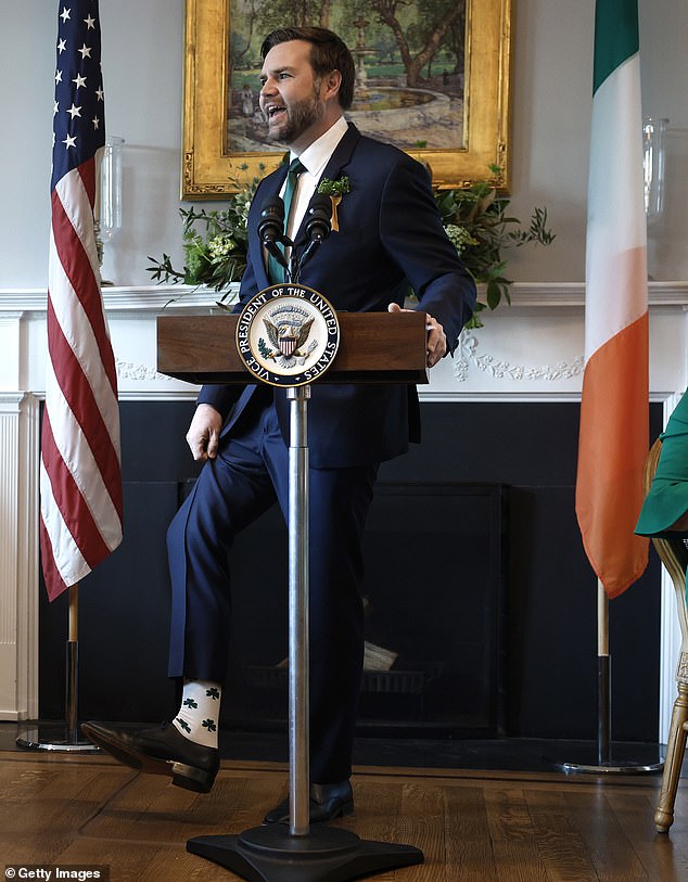 Vance caught Trump¿s attention with the Irish-themed shamrock-decorated socks he wore to meet the Irish Prime Minister Michael Martin in the Oval Office (pictured).