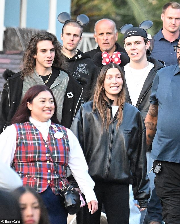 The gaunt singer–songwriter sported a buzzed haircut, though he got a little playful during the trip and put on some black plastic Mickey Mouse ears