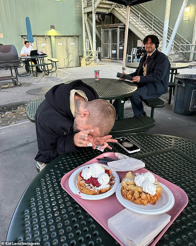 One photo showed Justin at a lunch table with his head down, and a platter of food in front of him