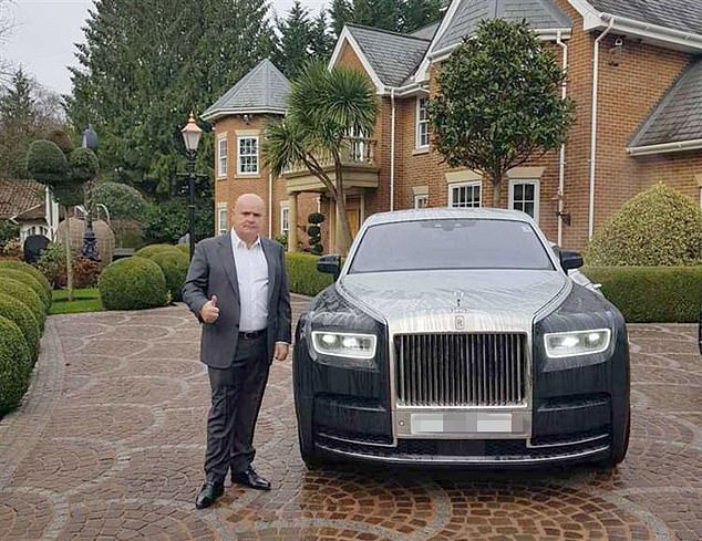 Multi-millionaire residential park owner 'Fred' Doe Senior, pictured with a luxury car, claimed his son may have been 'victimised' because of the family name and his gypsy roots