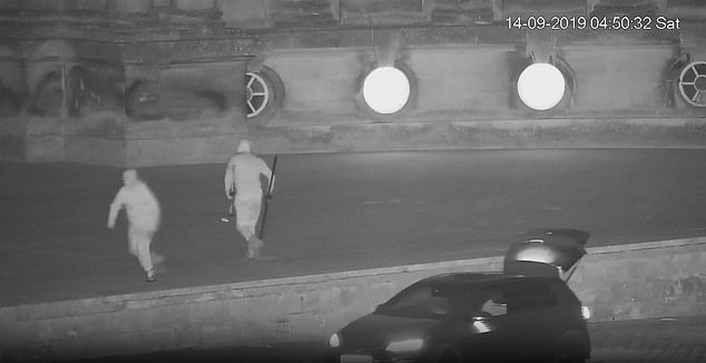 The sledgehammer-wielding gang were caught on CCTV (pictured) rolling the toilet out of smashed window and into the boot of a waiting car, before screeching away