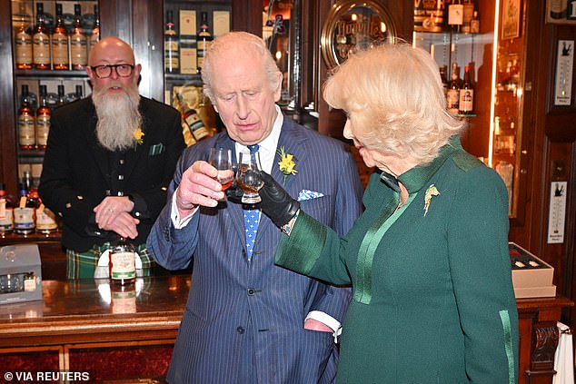 The pair were picture smiling cheekily at once another as they clinked their glasses before sampling the drinks