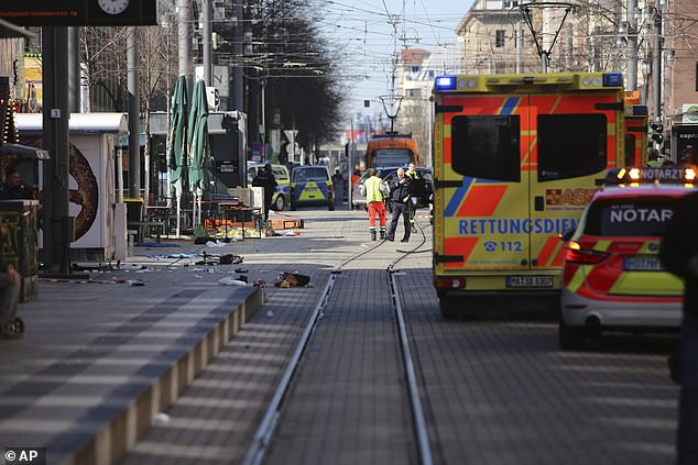 Emergency services and police stand at Paradeplatz in Mannheim, Germany, after a serious incident, Monday March 3, 2025