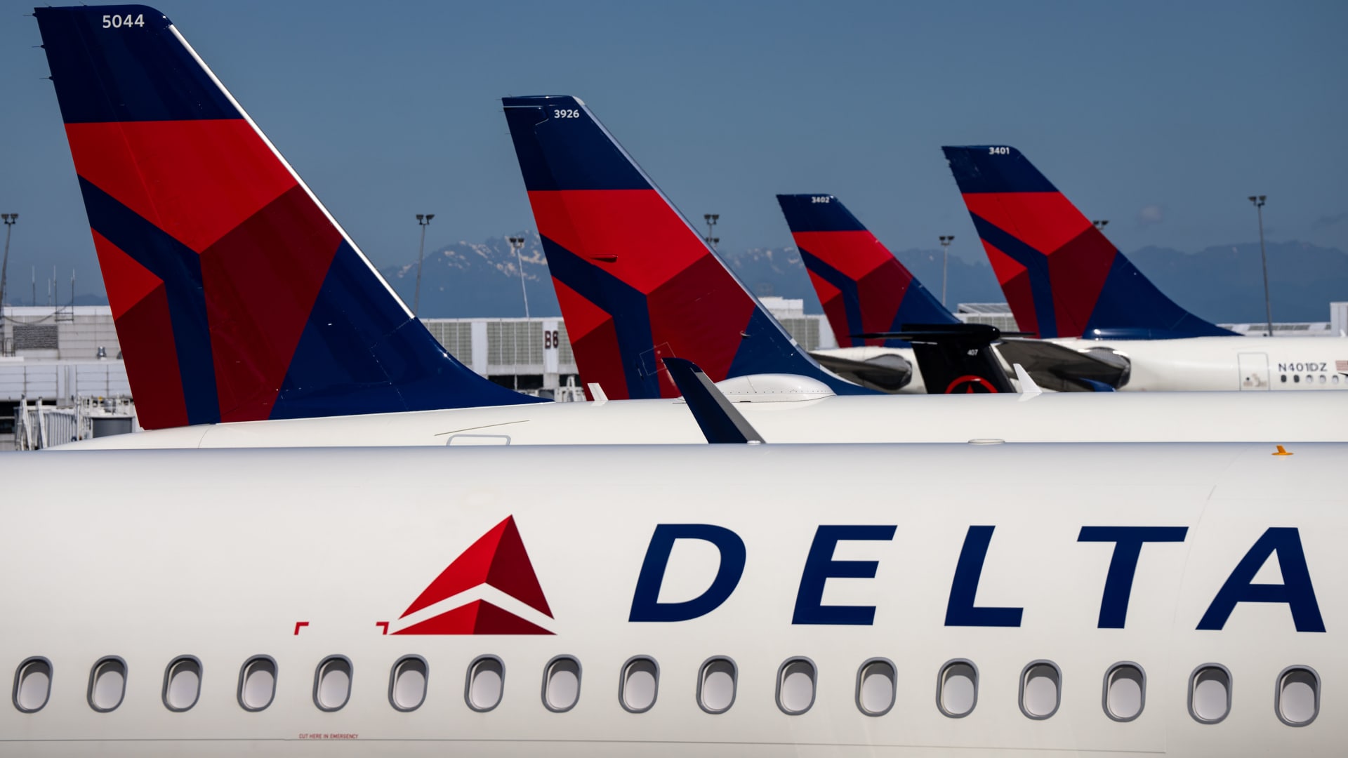 Delta Air Lines shares fall as airline cuts forecasts, citing weaker domestic demand