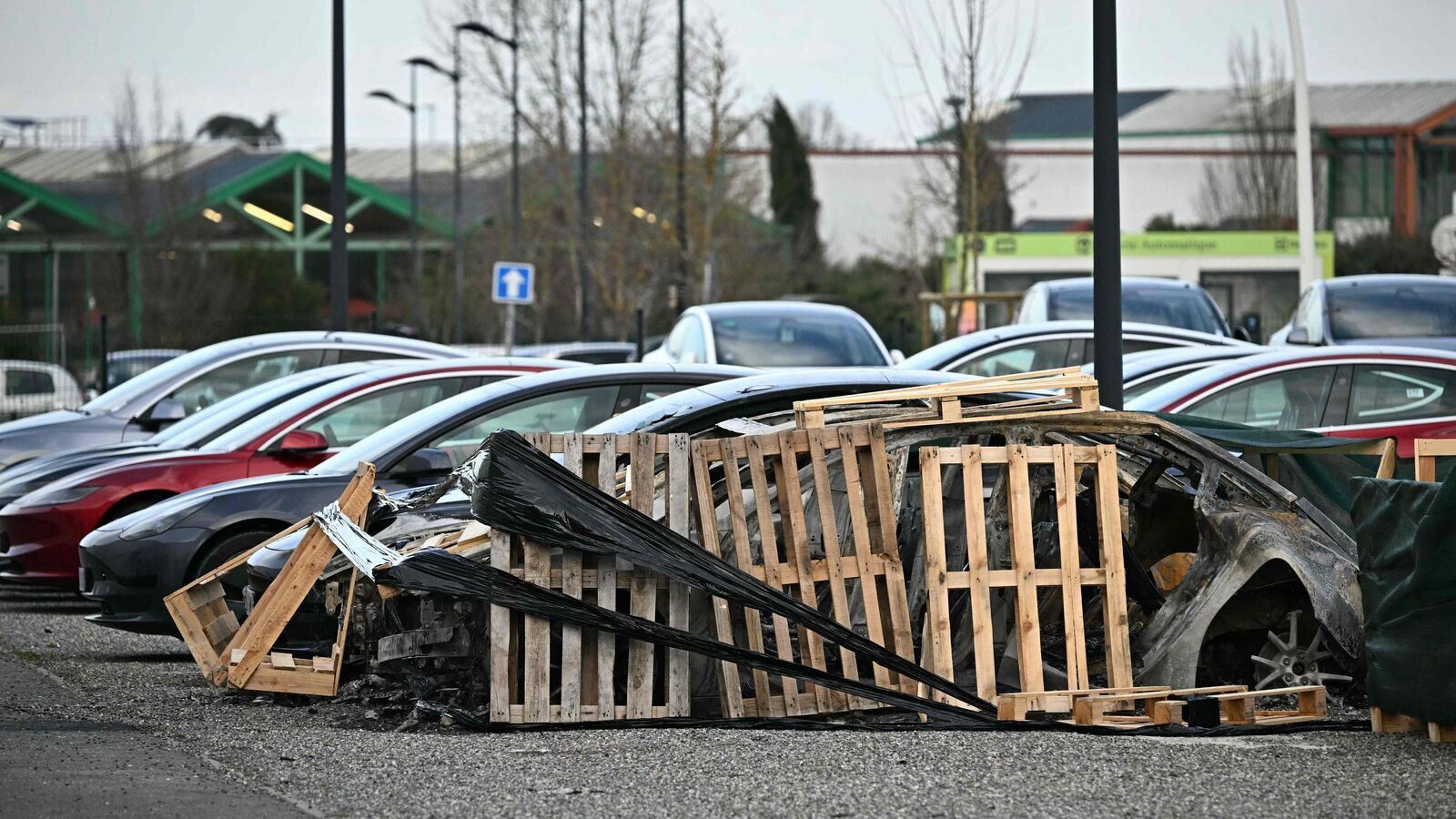 A Tesla car damaged in a blaze caused by an alleged arson attack in the early hours of the morning of March 3, 2025, sit parked outside a Tesla dealership in Plaisance-du-Touch, near Toulouse.