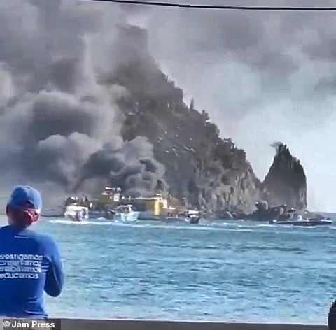 Thick black smoke was seen billowing into the sky in footage filmed from another boat as the passengers frantically swam away from the burning vessel