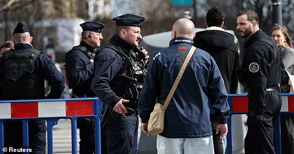 French police secure the area close to the site where an unexploded bomb dating back to World War Two was discovered 2.5 km (1.55 miles) from the Paris Gare du Nord train station, which has disrupted train traffic, in Saint-Denis near Paris, France, March 7, 2025. REUTERS/Benoit Tessier