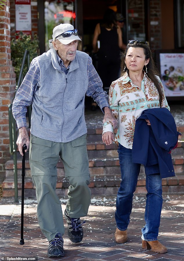 The gas company aiding in the investigation into the deaths of Gene Hackman and his wife Betsy Arakawa discovered a 'minuscule leak at one of the stove burners' in their Santa Fe home. Hackman and Arakawa are pictured in Santa Fe, New Mexico in March 2024. It was the first time in two decades that the couple were seen out and about