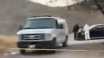 Pictured: Authorities search the deserted car in San Jose Miahuatlan containing mutilated bodies