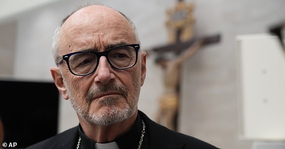 FILE - Cardinal Michael Czerny meets with journalists at the Vatican press hall, in Rome, on March 30, 2023. (AP Photo/Gregorio Borgia, File)