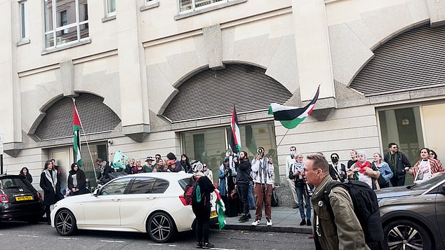 A group of militant pro-Palestine protestors 'rallied' outside a London police station this afternoon in protest over the barefoot Big Ben scaler who was arrested